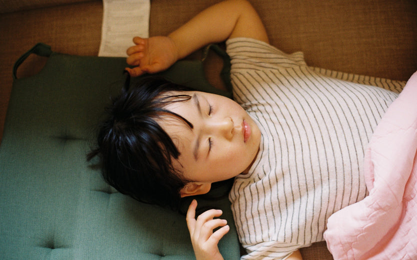 Boy sleeping in bed