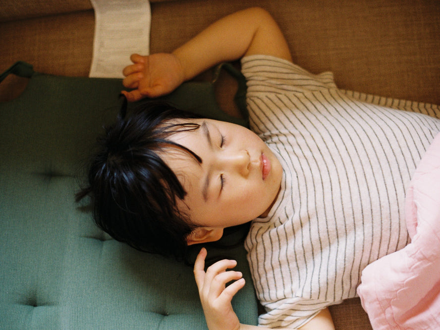 Boy sleeping in bed