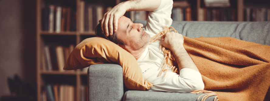 Person unwell resting on the couch
