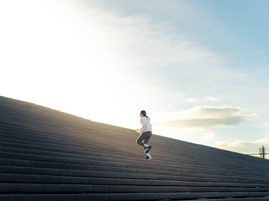 Person running up stairs