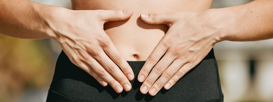 Image of someone holding their stomach