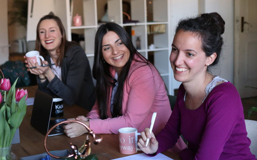 Young women sitting in cafe talking