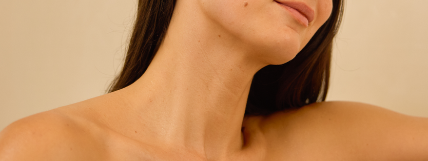 Image of a person's jaw and decolletage