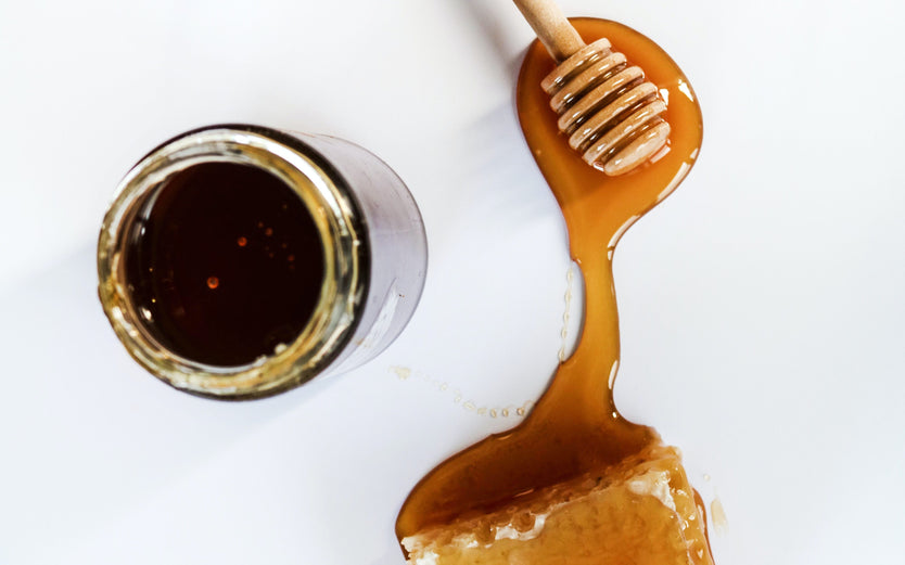 Honey poured onto a white surface