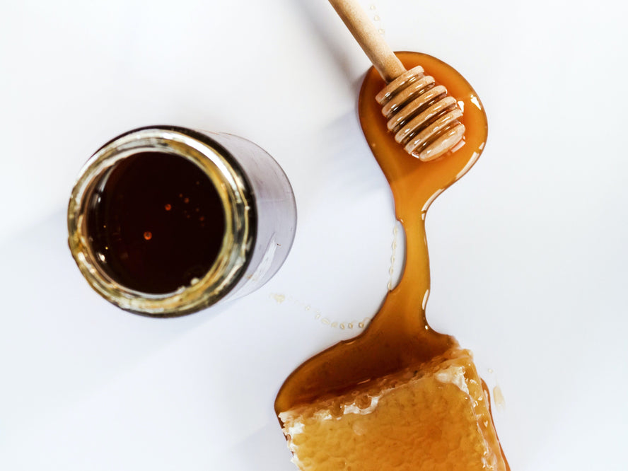 Honey poured onto a white surface