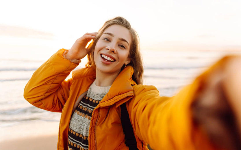 Person on the beach taking a selfie