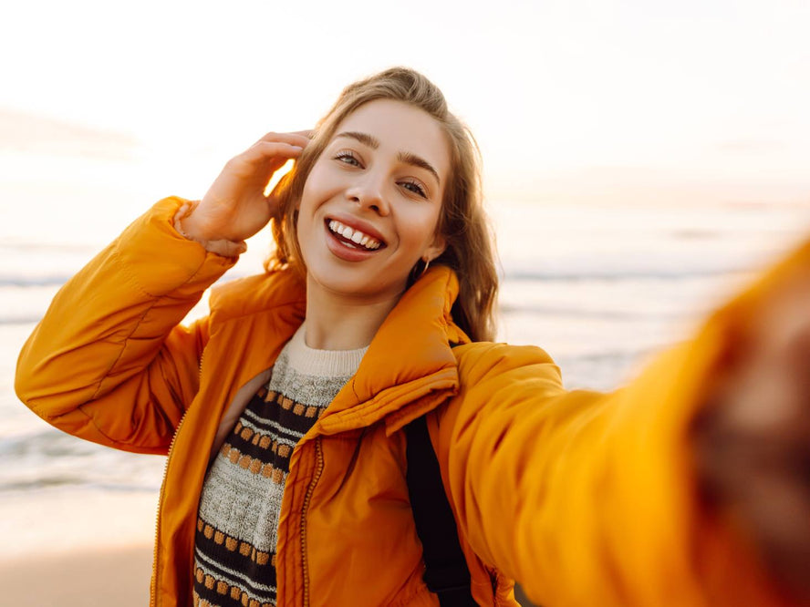 Person on the beach taking a selfie