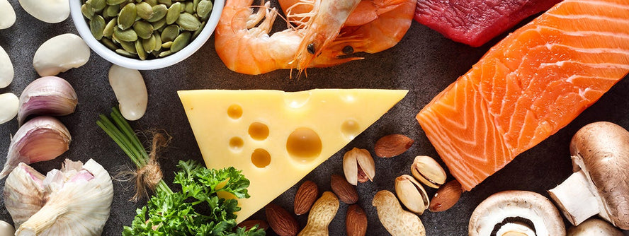 Foods high in zinc like salmon, cheese, nuts and seeds