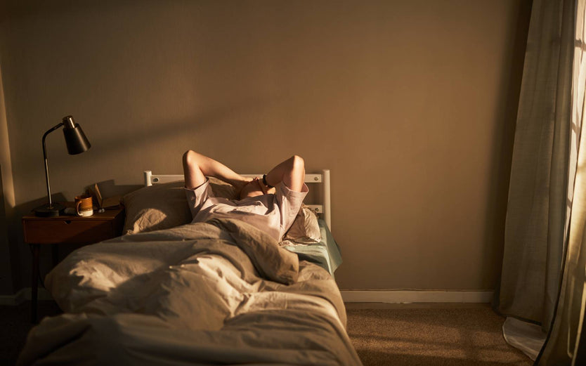 Person stressed in bed