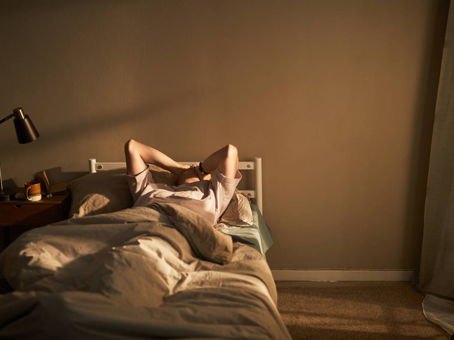 Person stressed in bed