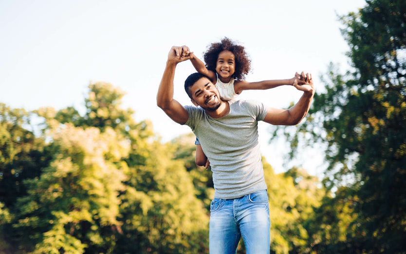 Father and daugher playing outside