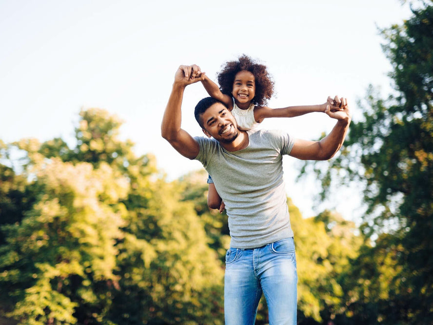 Father and daugher playing outside