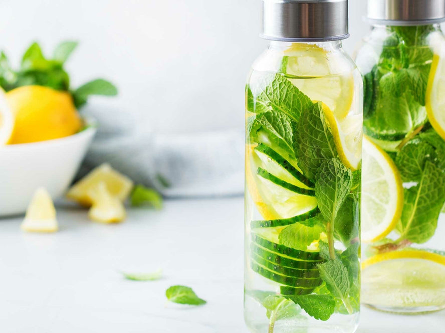 Bottles of water infused with lemons and herbs