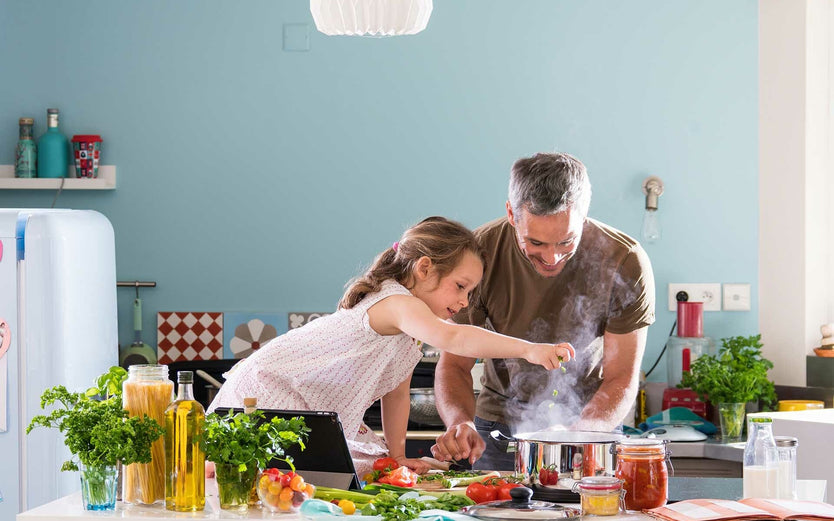Child cooking with grownup