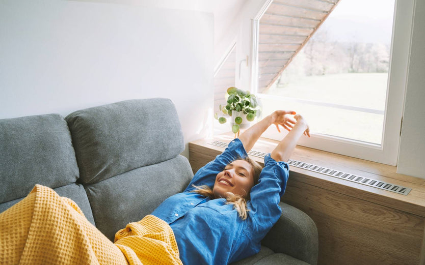 Person stretching after a sleep on the couch
