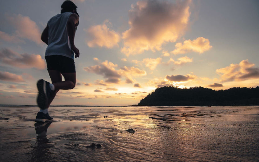 Man running at daylight savings on beach
