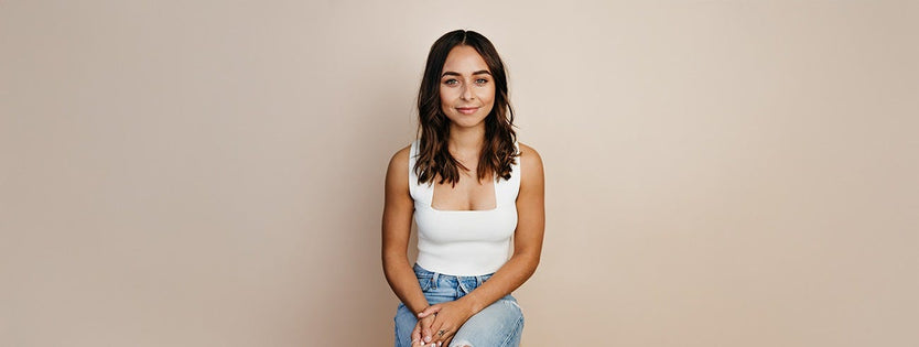 Brooke Blurton sitting on a chair