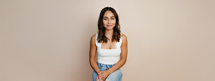 Brooke Blurton sitting on a chair