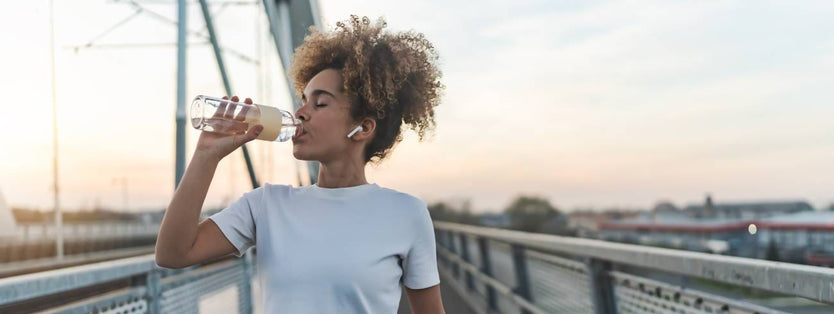 Women drinking a bottle of water