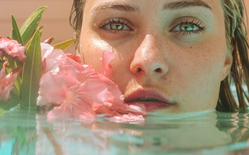Woman in water with flower