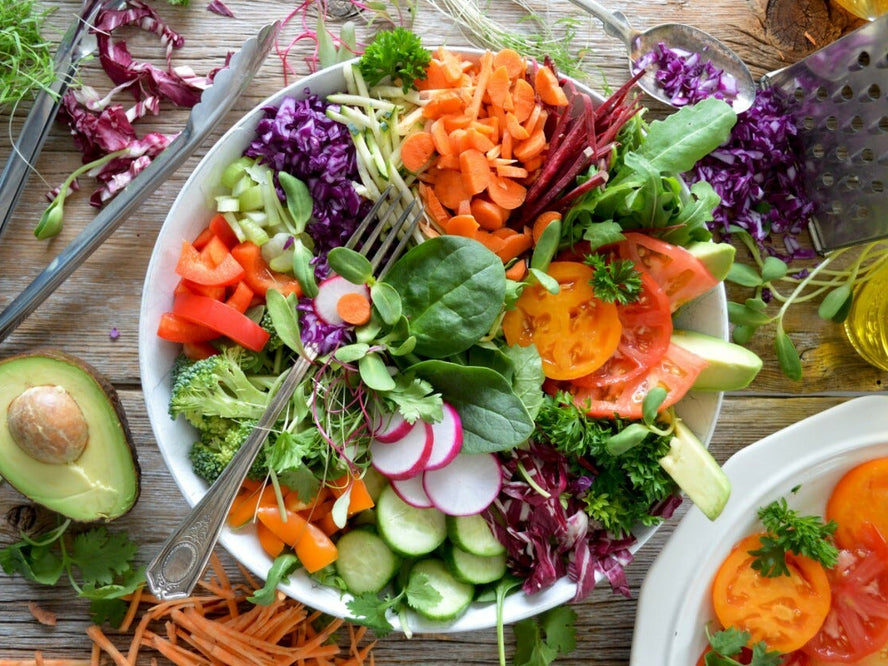 A birdseye view of a salad in a bowl on a table