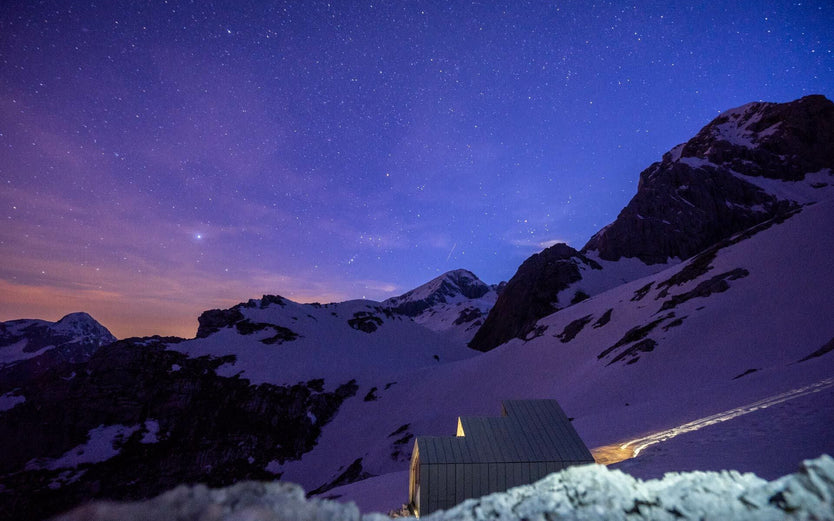 Small cabin under a night sky