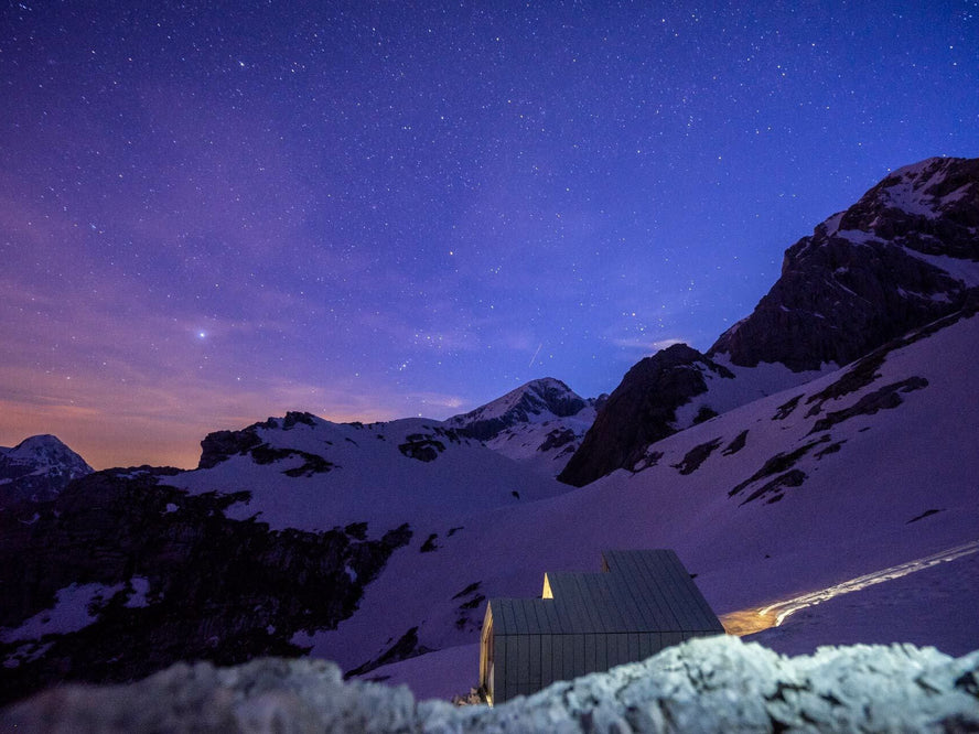 Small cabin under a night sky