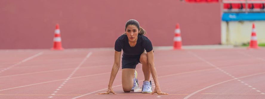 Person focussing at the start of track race.