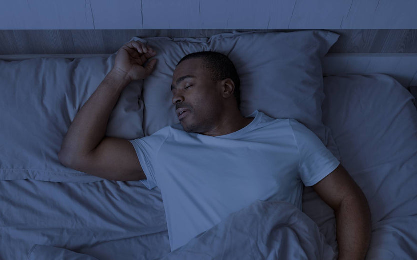 Someone sleeping in a dark room