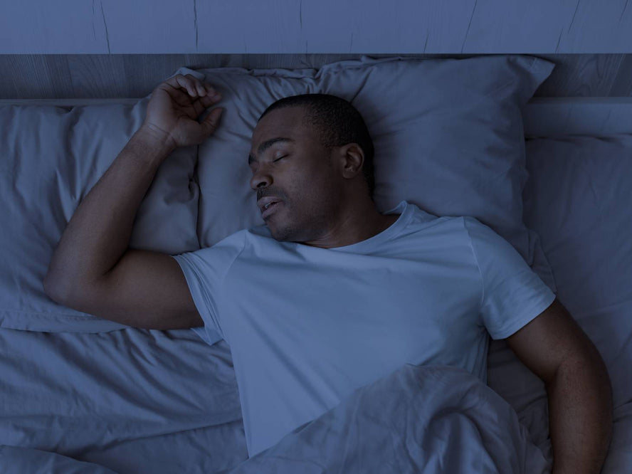 Someone sleeping in a dark room