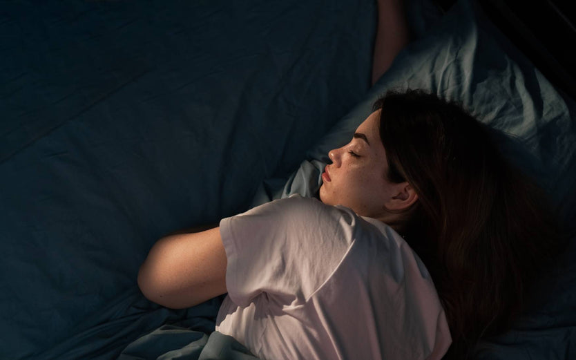 Person sleeping in a dark room