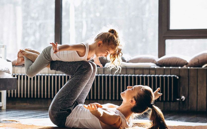 Mum and child doing yoga together
