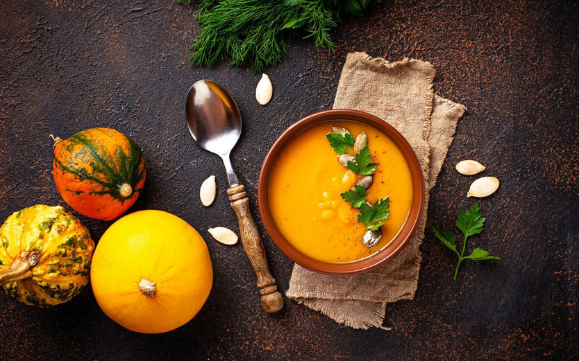 Pumpkin and red lentil soup on a table