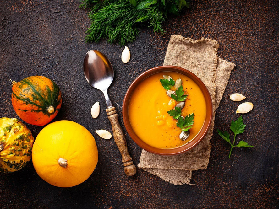 Pumpkin and red lentil soup on a table