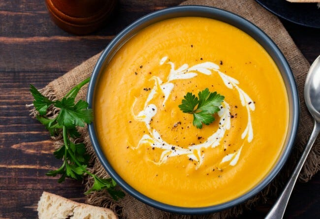 Roasted carrot and pumpkin soup in a bowl