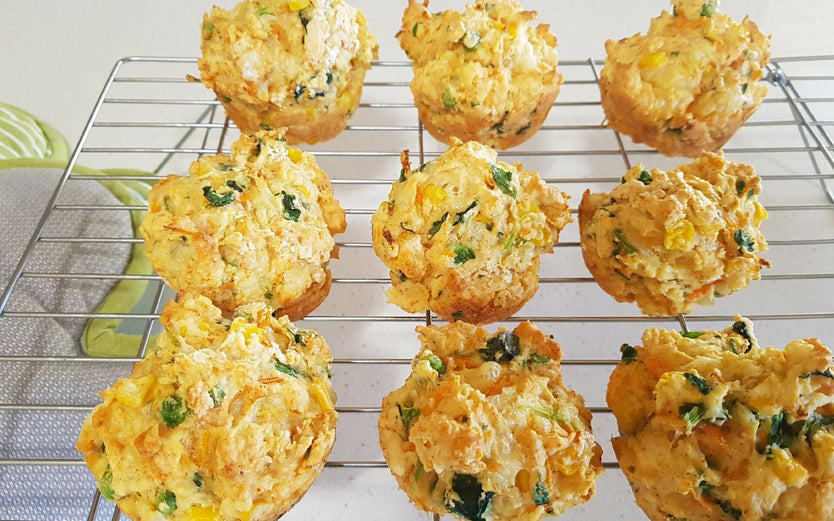 Healthy veggie muffins on a wire rack