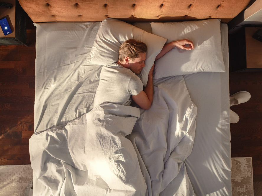 Man lying in bed asleep