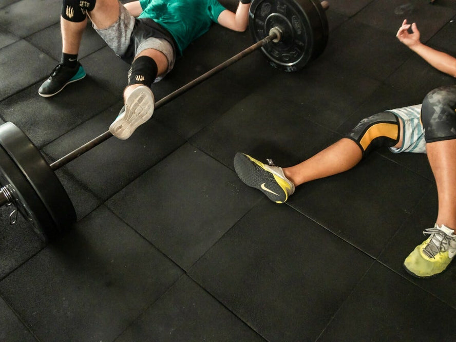 People laying on the floor of a gym