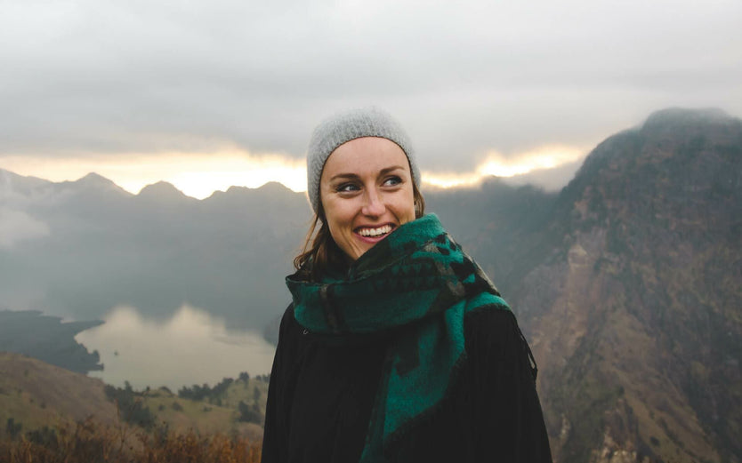 Woman smiling in mountains probiotics