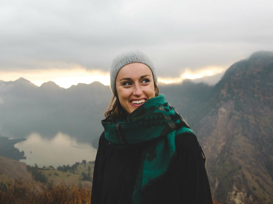 Woman smiling in mountains probiotics