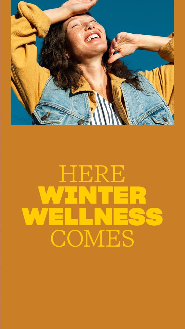 Person wearing a denim jacket with text 'Here winter wellness comes' on a brown background