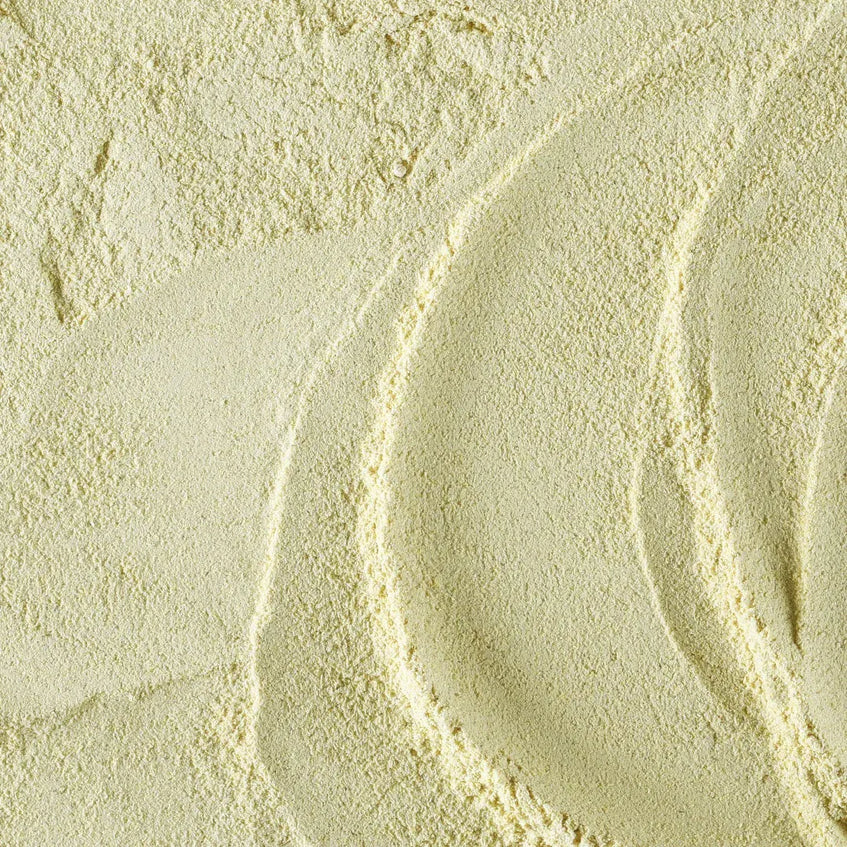 Close-up of light-colored sand with natural patterns
