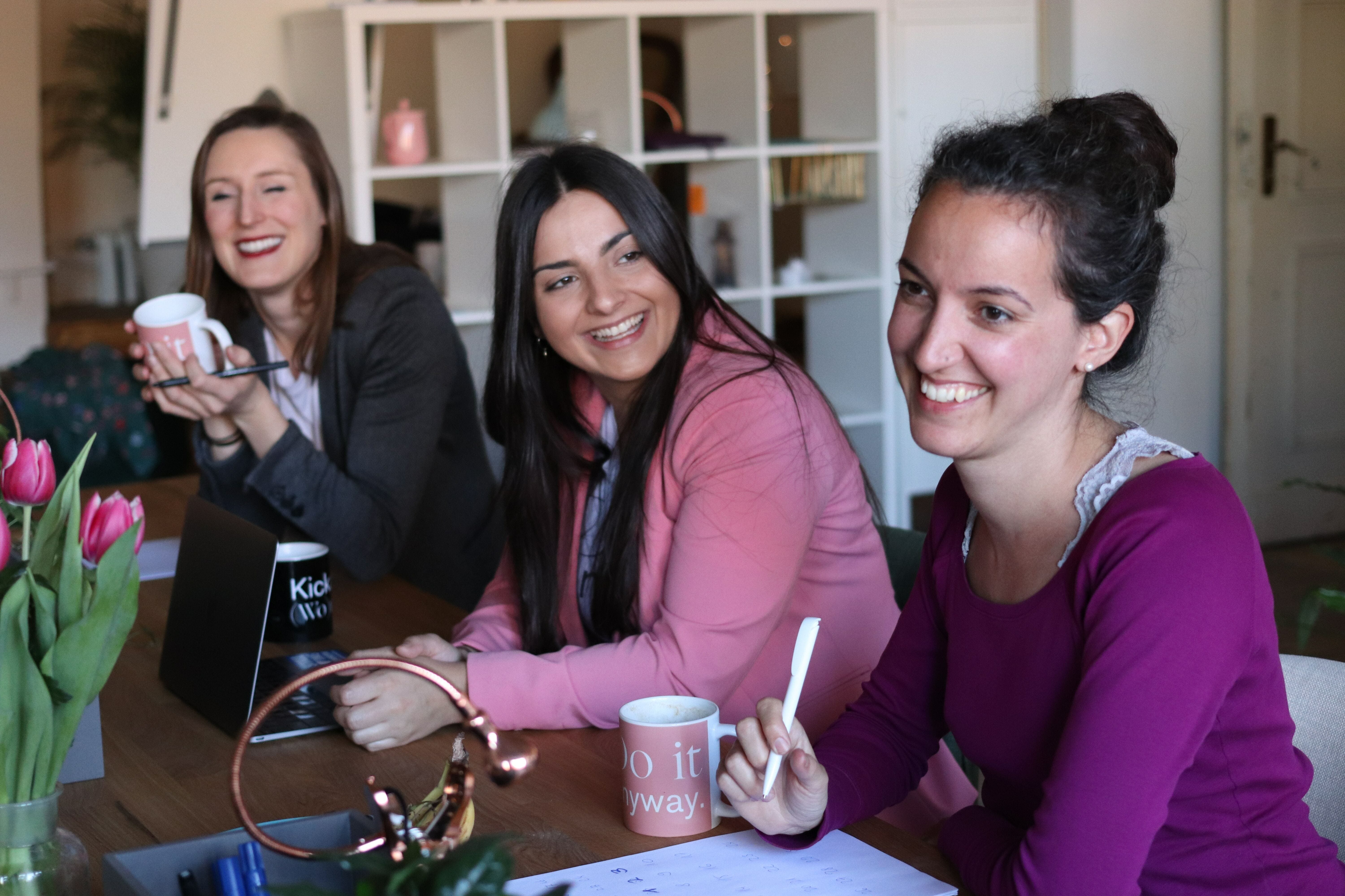 Young women sitting in cafe talking