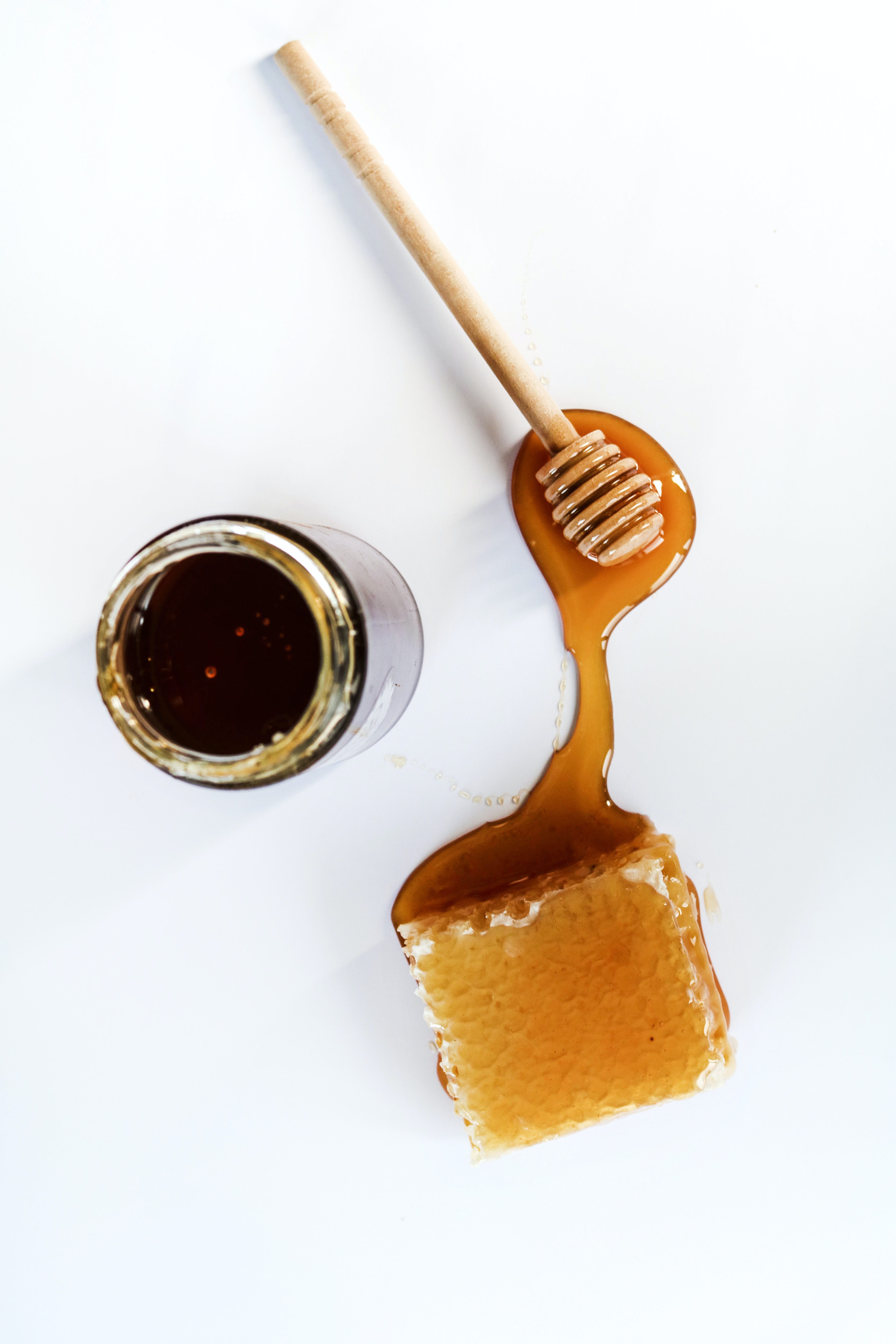 Honey poured onto a white surface