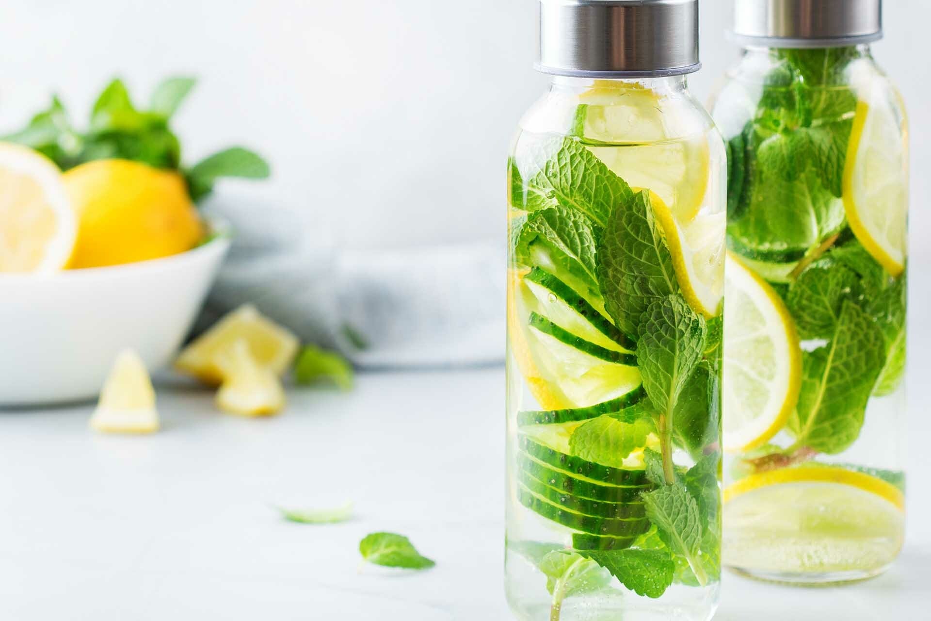 Bottles of water infused with lemons and herbs