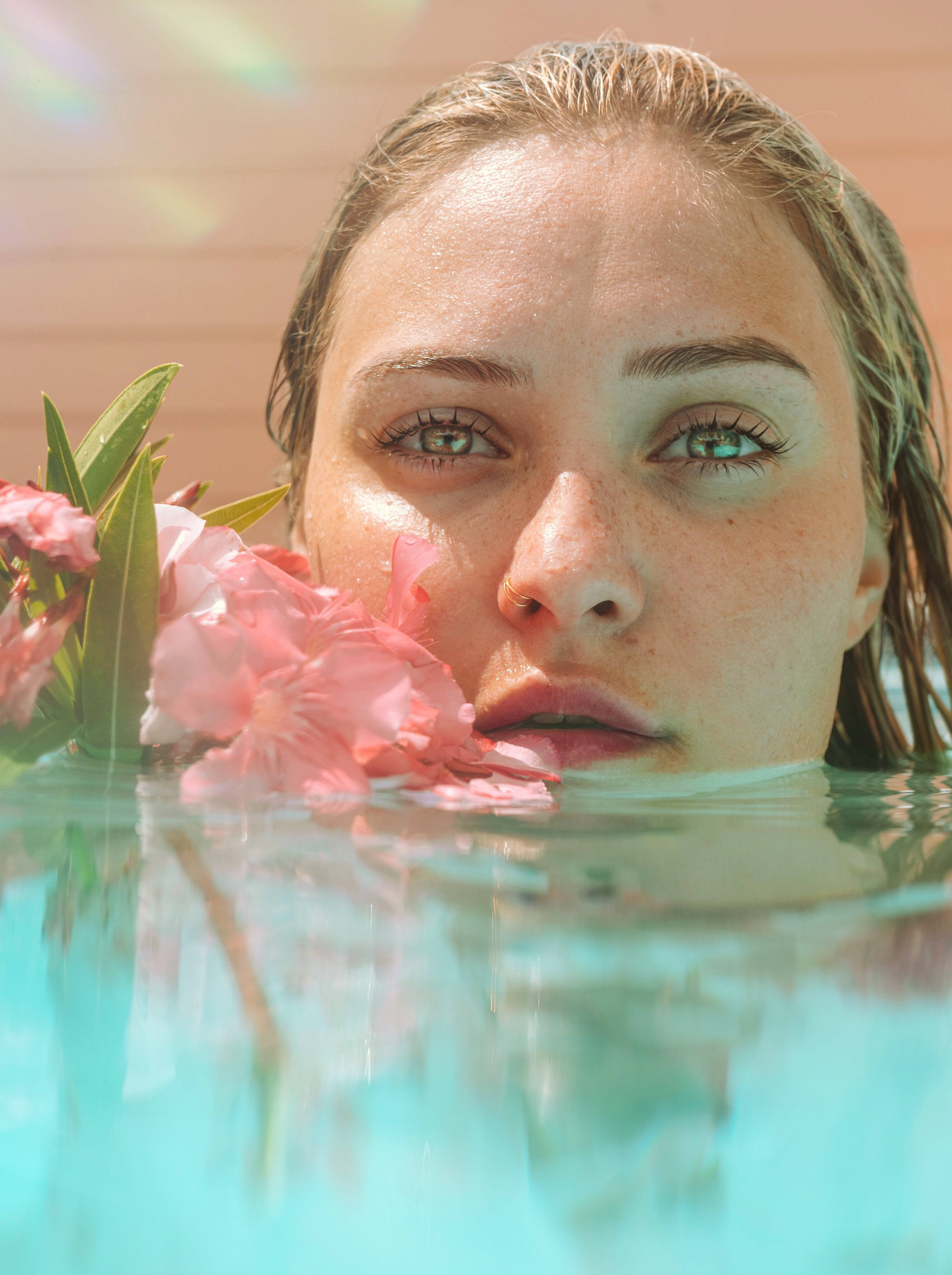 Woman in water with flower 