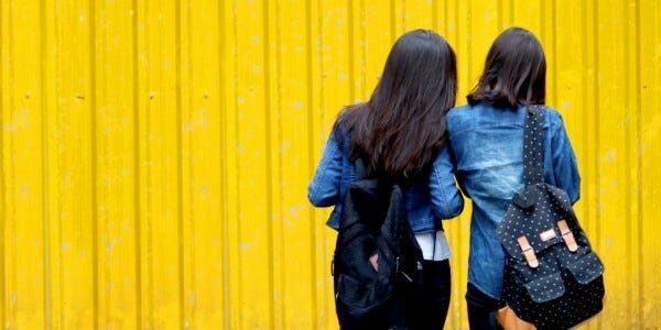 Two women in denim jackets