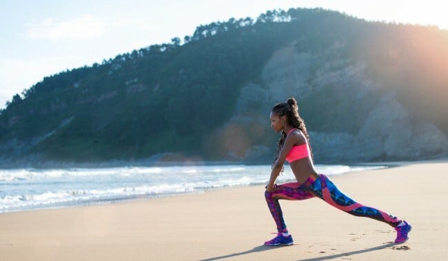 Woman stretching on a beach