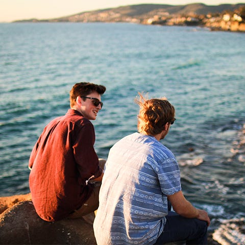 Two men looking out over water