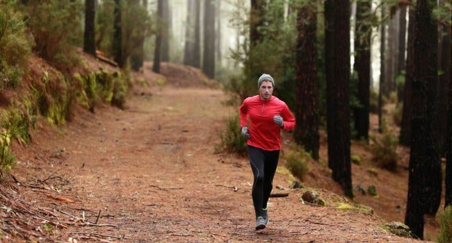 Man jogging in forest